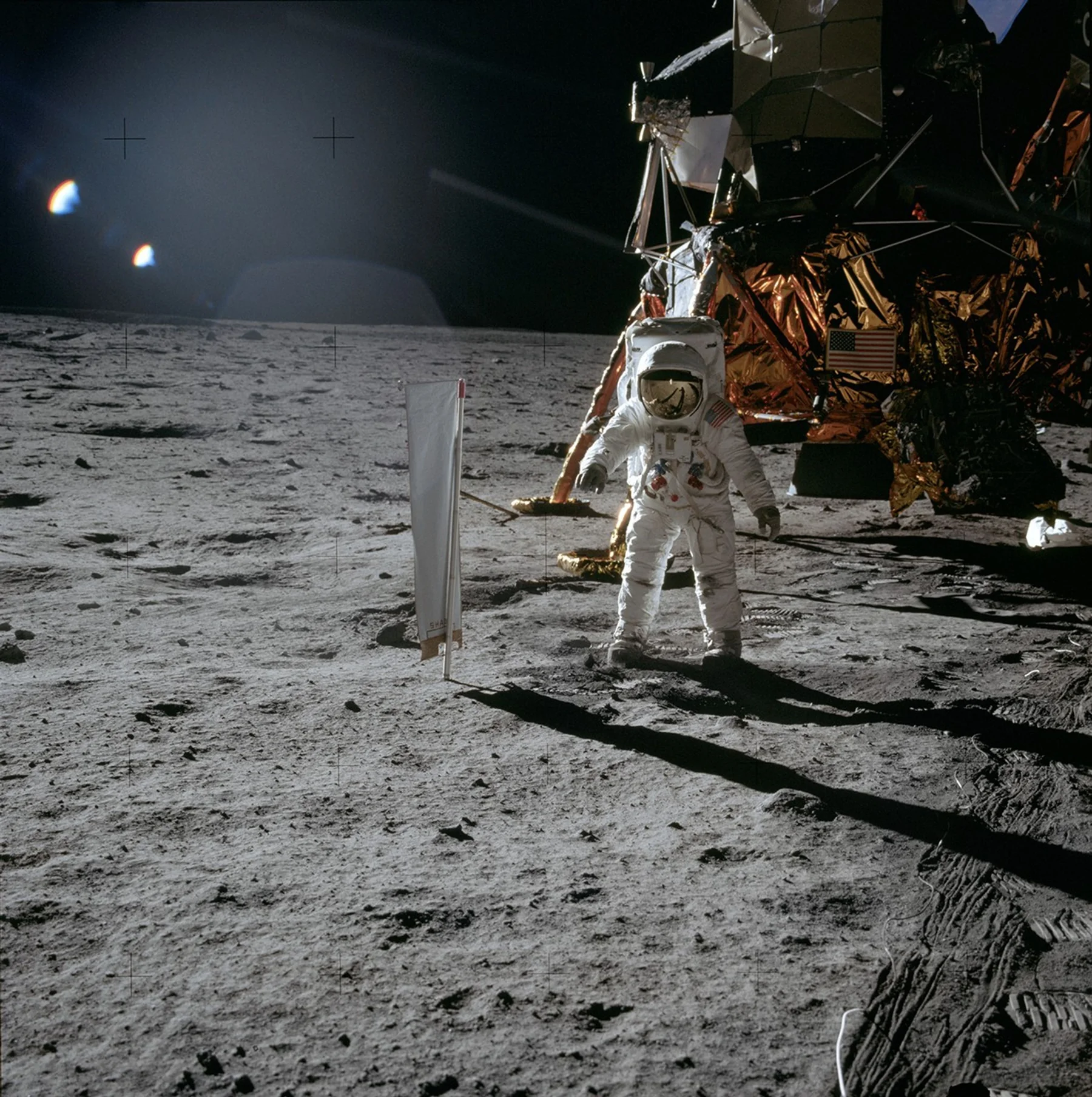 Apollo 11 astronaut Buzz Aldrin on the lunar surface with the Lunar Module in the background